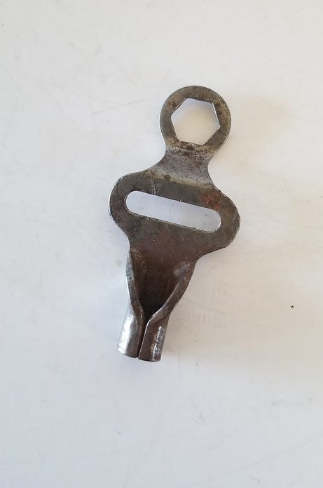 Photo of a vintage metal skate key.