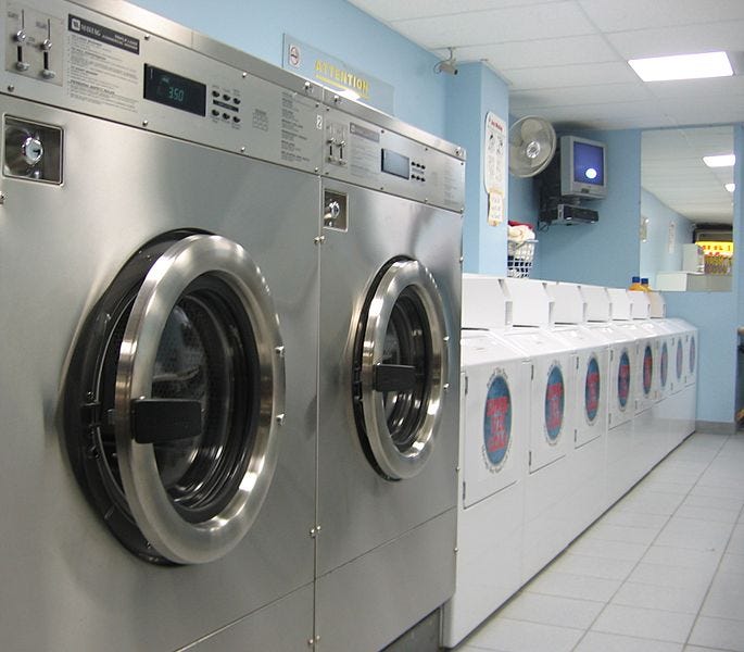a photograph showing washing machines at a laundromat in ontario, canada