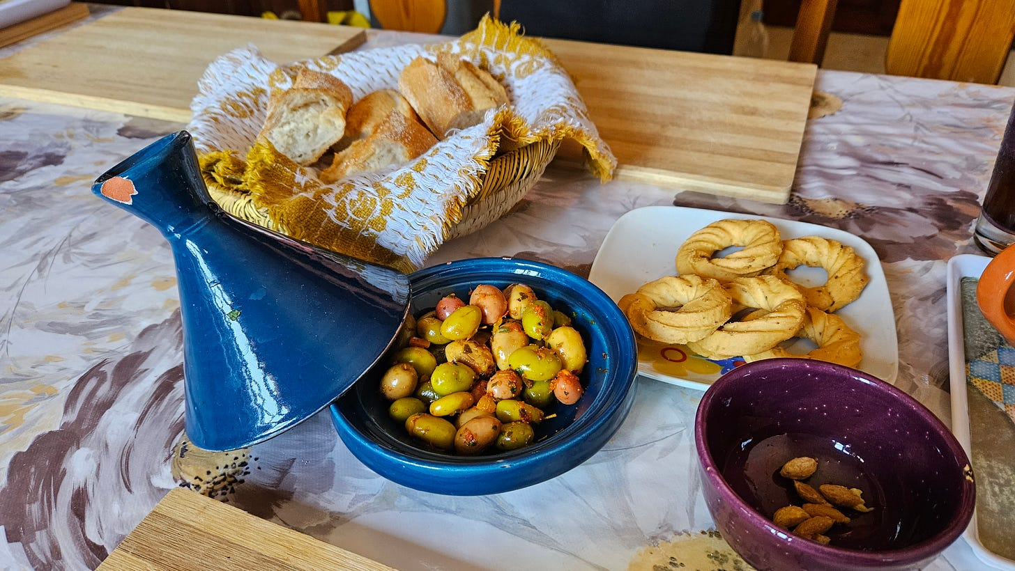 a delicious snack of bread, olives and mint tea