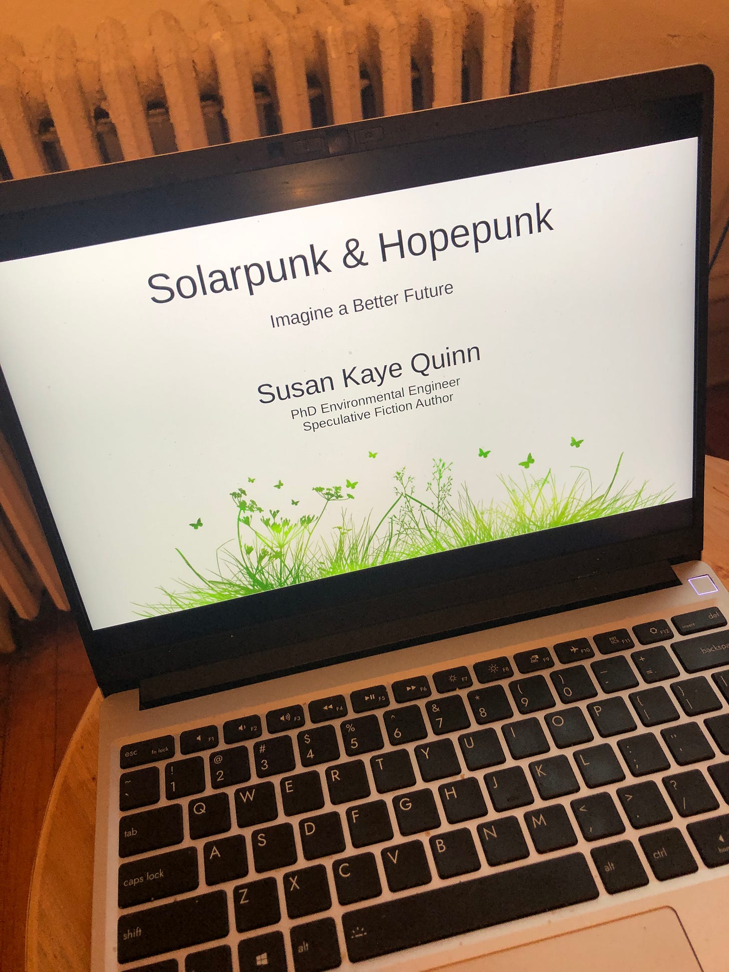 Sue's laptop at her solarpunk writing class on Governor's Island with the title slide: Solarpunk and Hopepunk