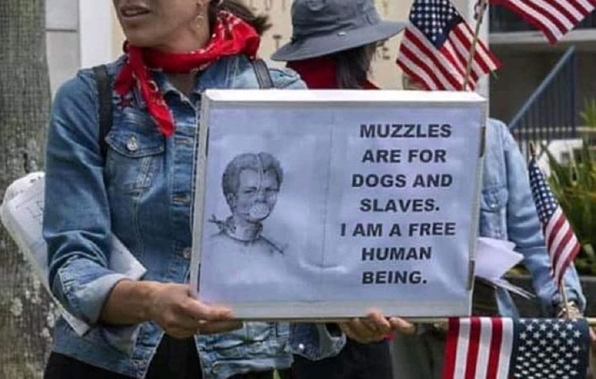 Is This 'Muzzles Are for Dogs and Slaves' Protest Sign Real? | Snopes.com