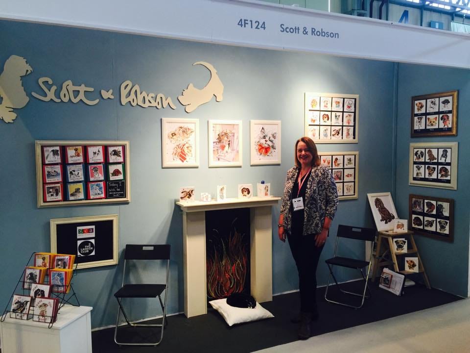 Jo Scott standing at her greeting card trade stand 