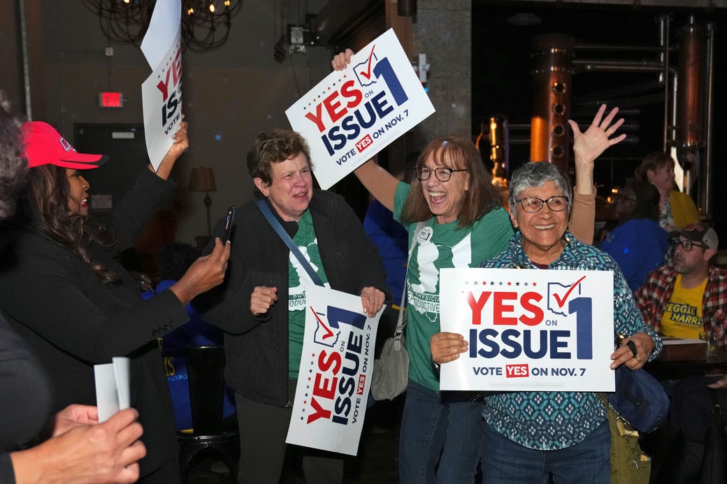 Voters reacts to the passage of Ohio Issue 1, a ballot measure to amend the state constitution and establish a right to abortion, at an election night party.