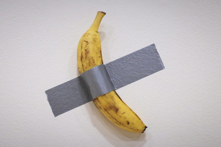 Maurizio Cattelan’s duct-taped banana, titled “Comedian,” is displayed at Sotheby’s in New York on Nov. 8.