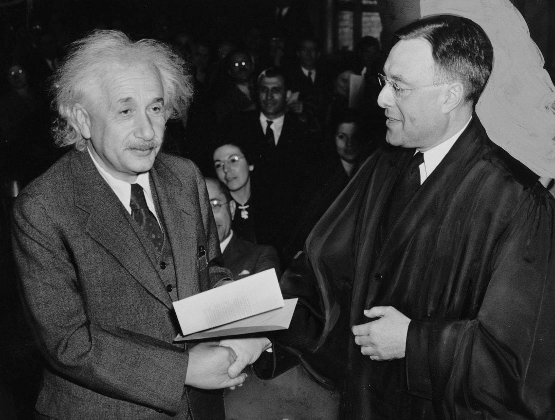 Albert Einstein receives his certificate of American citizenship. Albert Einstein receives his certificate of American citizenship.