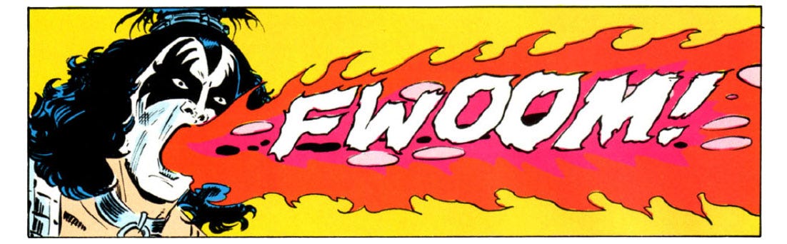 A panel from this issue. It shows Gene Simmons (in his “demon” makeup) spitting fire. Sound effect is “fwoom!”