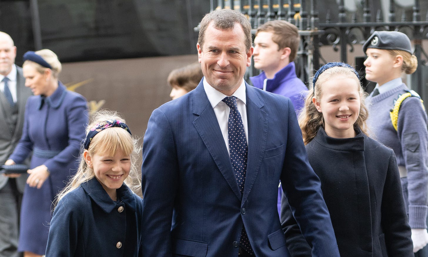 Peter Phillips holding hands with daughters Savannah and Isla