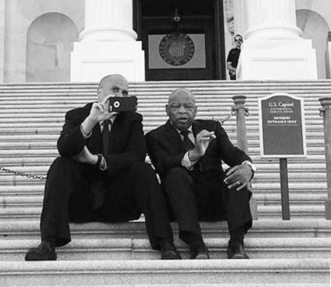 Two men sitting on steps taking a picture of themselves

AI-generated content may be incorrect.