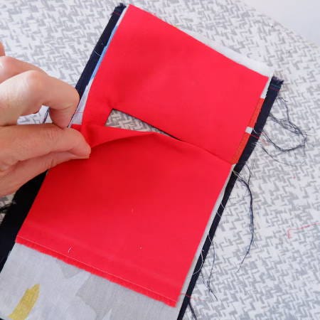 showing the pocket opening behind the welt fold