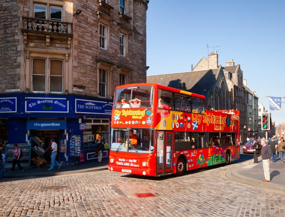 May be an image of 10 people, tram, street and text