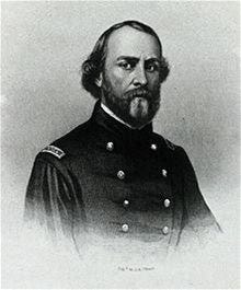Headshot of Sullivan Ballou a balding man in a union uniform with two rows of buttons.