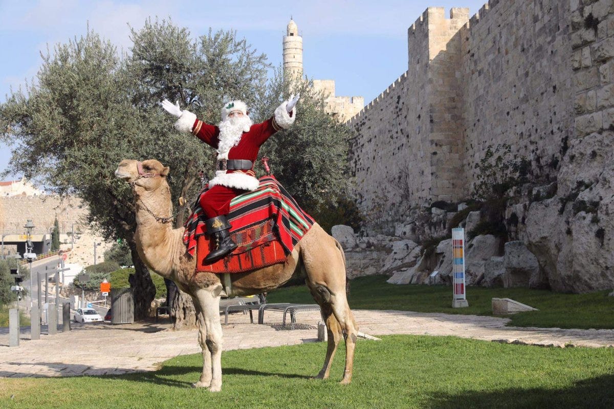 In Jerusalem, Santa rides a camel instead of a sled pulled by reindeer.