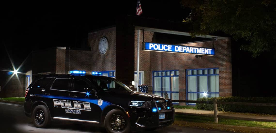 Photo of an Easton police cruiser outside the Easton Police Department during nighttime.