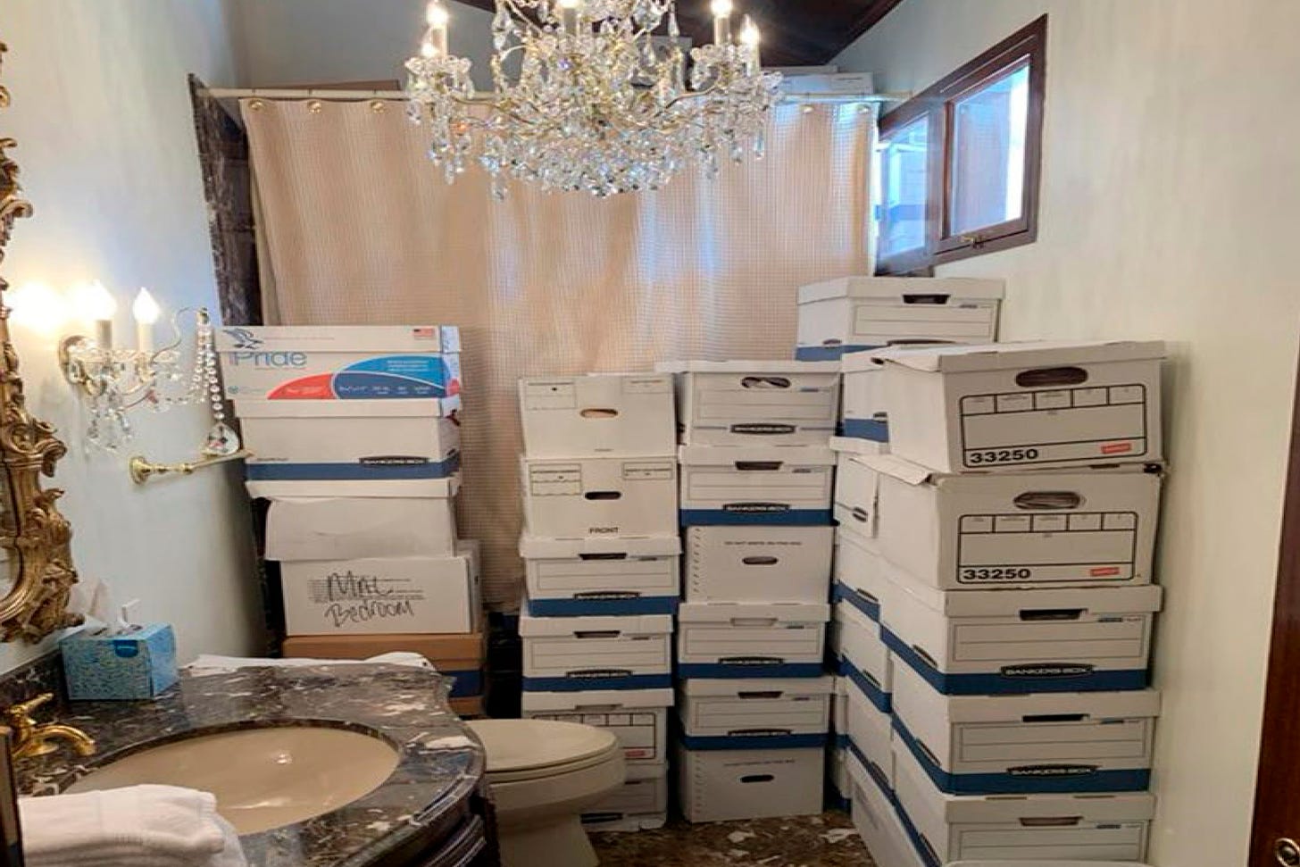 Boxes of records stored in a bathroom and shower in the Lake Room at Trump's Mar-a-Lago estate in Palm Beach, Fla.