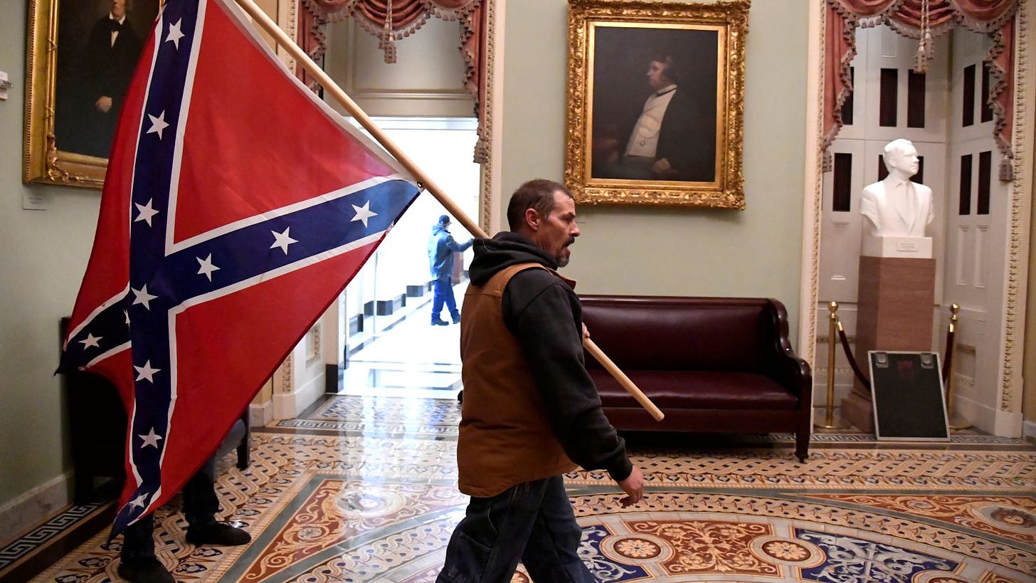 Man who carried Confederate flag in US Capitol and son found guilty of  felonies | CNN Politics