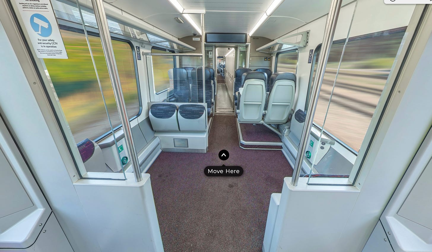 Screenshot of the virtual too, interior of a Stadler train, two wheelchair spaces and other seats visible