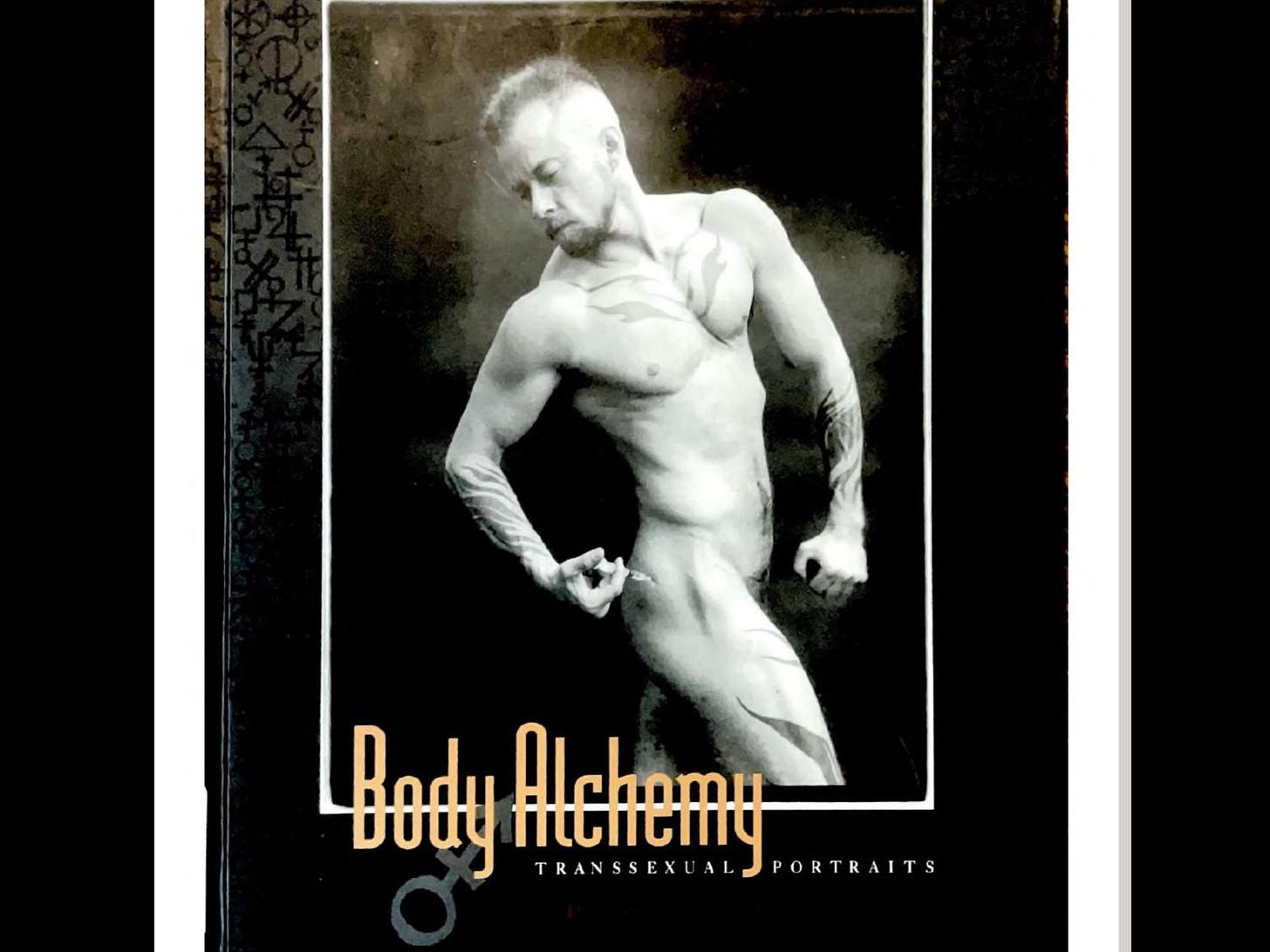 The cover of 'Body Alchemy' by Loren Cameron, which is mostly black with the title in pale yellow text and shows a black and white photo of a nude Cameron leaning backwards to inject his upper thigh with testosterone