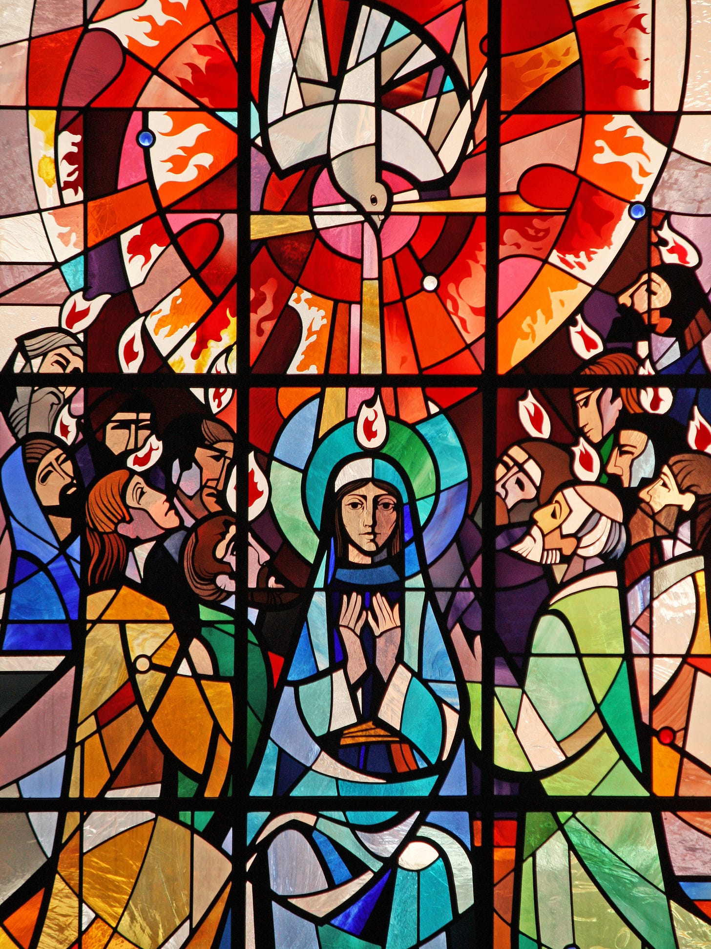 A modern stained glass window from St Aloysius' church in Somers Town, London of the Holy Spirit descending on Our Lady and the apostles, as is recounted in Acts 2:1-11.     Today, 31 May 2009, is Pentecost Sunday, when the Church commemorates the Descent of the Holy Spirit on the apostles, giving her new life and power to proclaim the Gospel of the risen Lord.