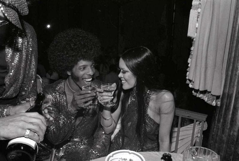 Sly Stone at a party with wife Kathy Silva