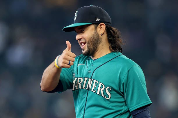 Eugenio Suarez of the Seattle Mariners gives a thumbs up to fans during the game against the Texas Rangers at T-Mobile Park on September 30, 2023 in...