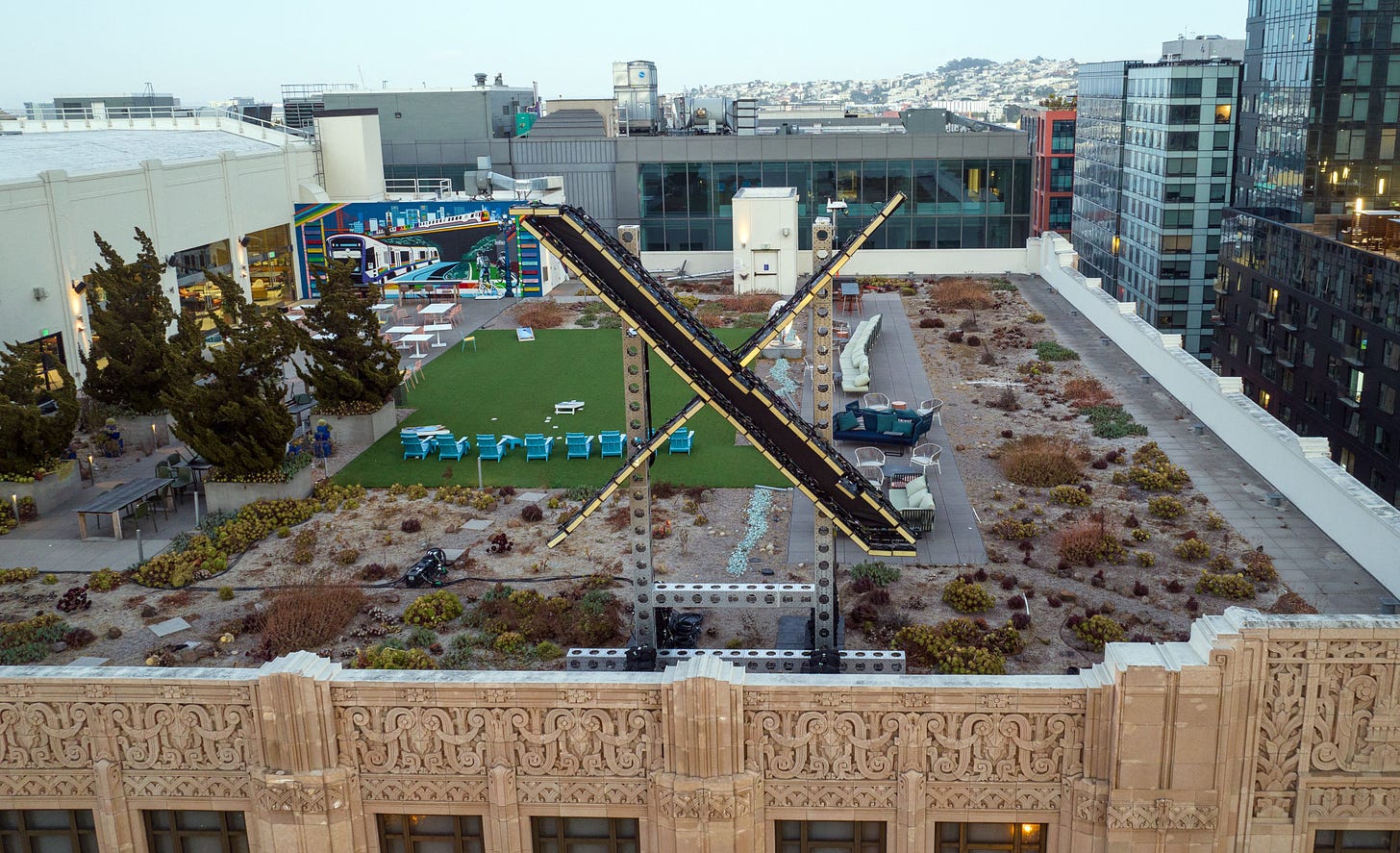 An aerial view shows a newly constructed X sign on the roof of the headquarters of the social media platform previously known as Twitter, in San Francisco, on July 29, 2023. Elon Musk killed off the Twitter logo on July 24, 2023, replacing the world-recognized blue bird with a white X as the tycoon accelerates his efforts to transform the floundering social media giant. Musk and the company's new chief executive Linda Yaccarino announced the rebranding on July 23, 2023, scrapping one of technology's most iconic brands in the latest shock move since the tycoon took over Twitter nine months ago. (Photo by JOSH EDELSON / AFP) (Photo by JOSH EDELSON/AFP via Getty Images)