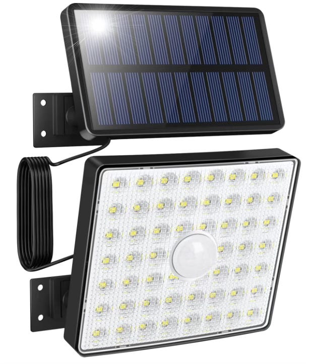A photo of an led spotlight tethered to a solar panel that powers the light.