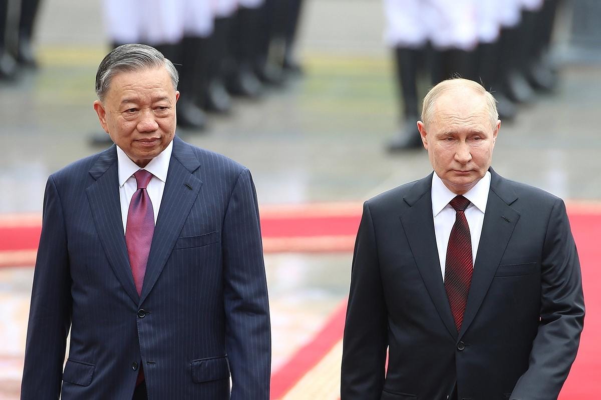 Vietnamese President To Lam and Vladimir Putin review an honour guard at the Presidential Palace in Hanoi, Vietnam, 20 June 2024. Photo: EPA-EFE / LUONG THAI LINH