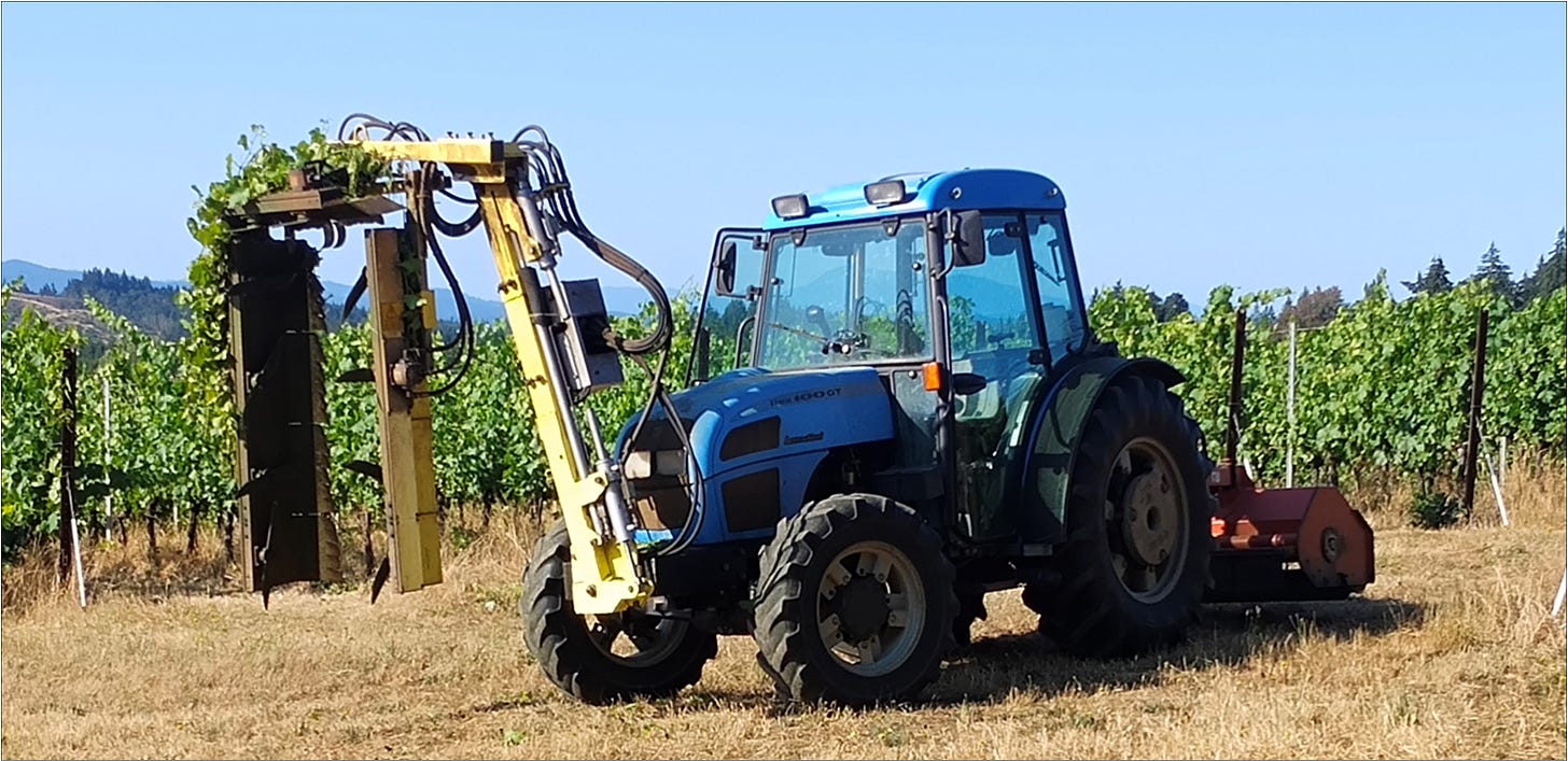 Landini tractor with hedger mounted on the front and flail mower out the back.