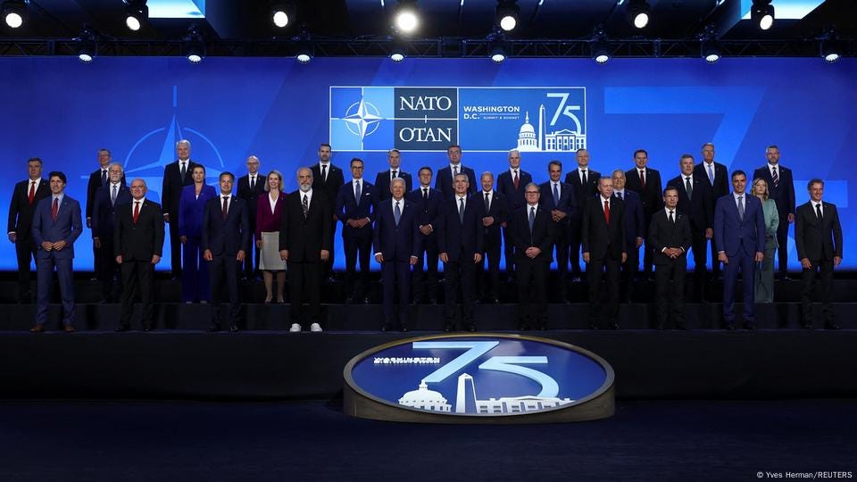 NATO Secretary General Jens Stoltenberg, U.S. President Joe Biden, Britain's Prime Minister Keir Starmer, German Chancellor Olaf Scholz, France's President Emmanuel Macron, Canadian Prime Minister Justin Trudeau, Italy's Prime Minister Giorgia Meloni, Spanish Prime Minister Pedro Sanchez, Hungary's Prime Minister Viktor Orban, Slovakia's President Peter Pellegrini, Greek Prime Minister Kiriakos Mitsotakis, and Albania's Prime Minister Edi Rama stand together as they attend NATO's 75th anniversary summit in Washington