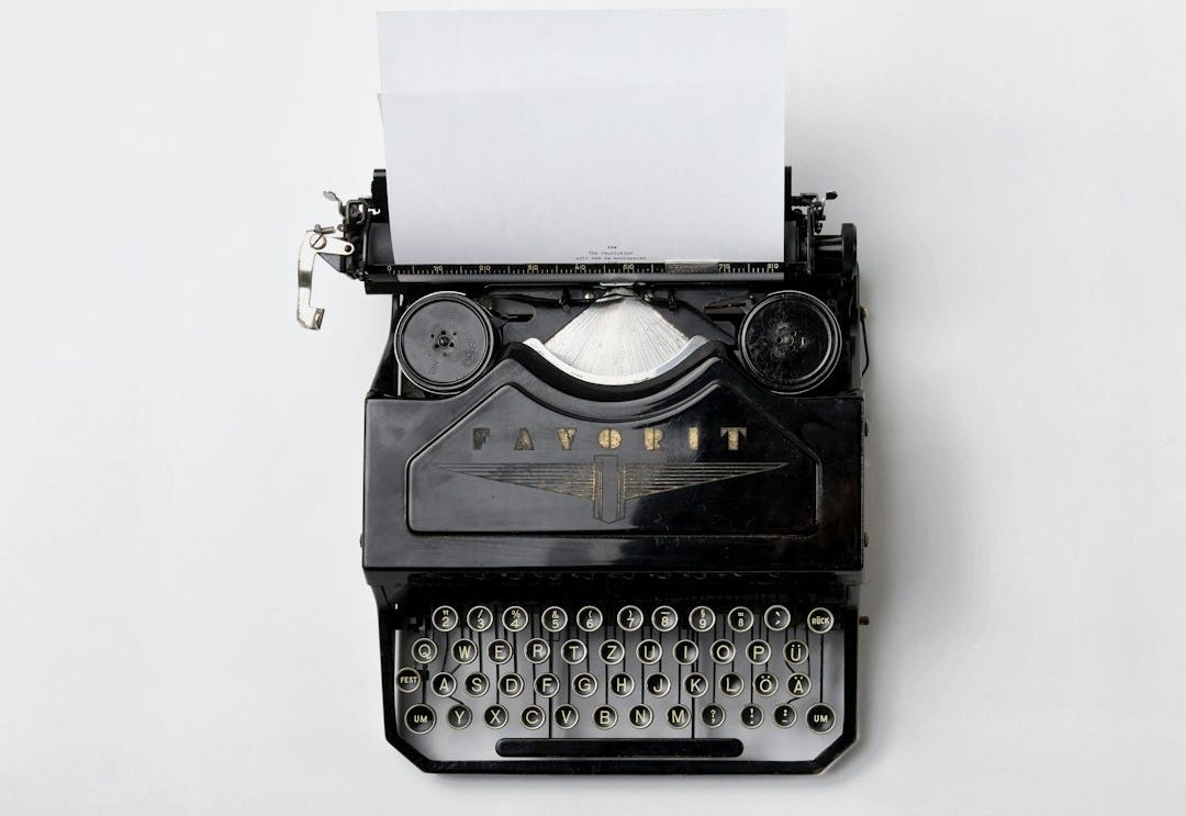 black Fayorit typewriter with printer paper black Fayorit typewriter with printer paper