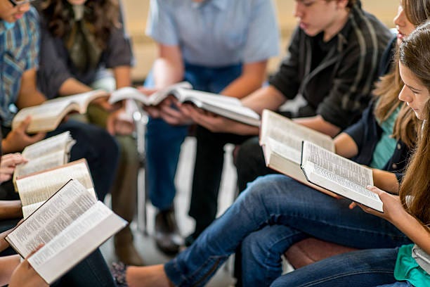 A group of high school students studying the Bible together. - Joy of ...