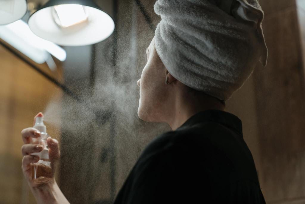 Woman is hydrating the skin