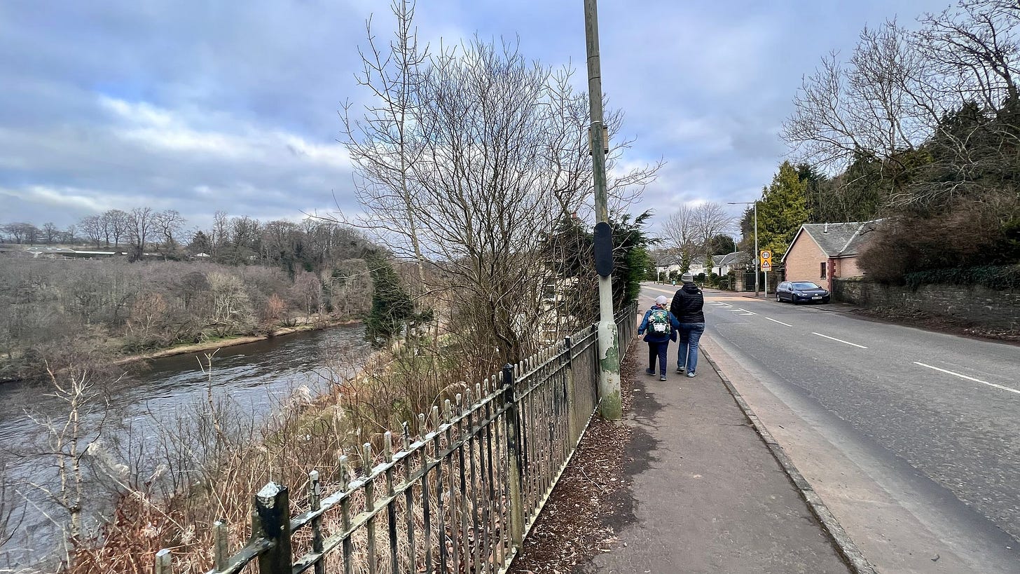 Walking down the road into Kitkfieldbank on the outskirts of Lanark