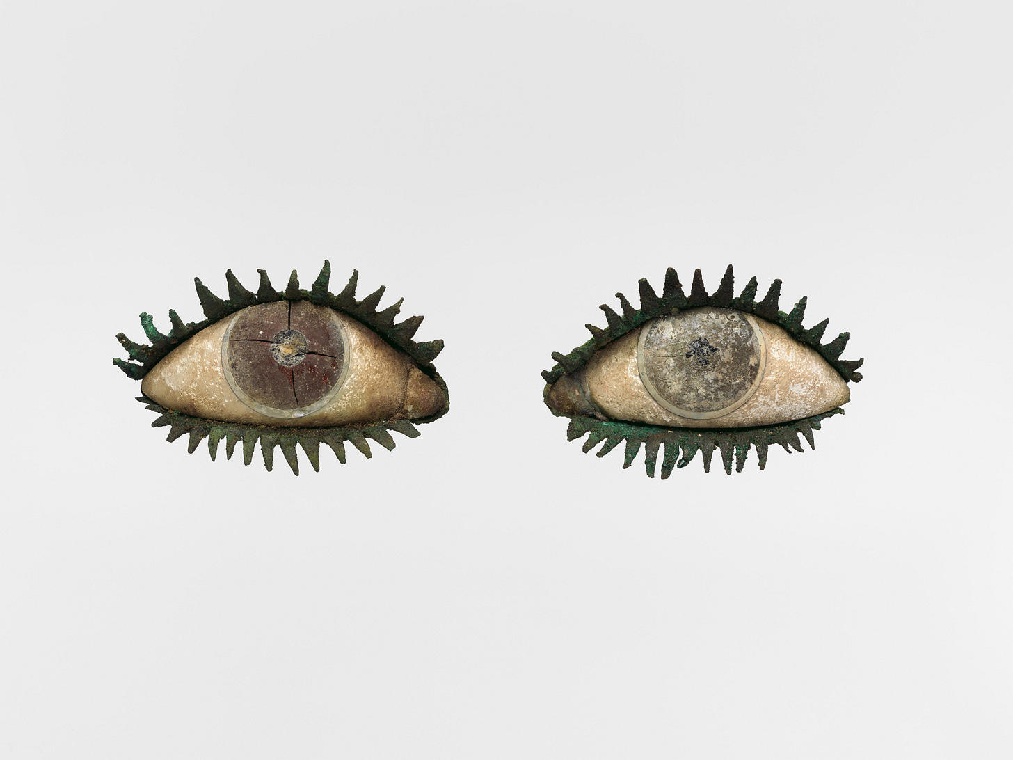 Two groovy eyes made out of wood, with metal eyelashes Two groovy eyes made out of wood, with metal eyelashes