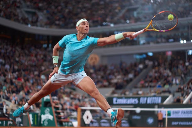 Rafael Nadal of Spain plays a backhand against Alexander Zverev of Germany in the Men's Singles first round match on Day Two of the 2024 French Open...