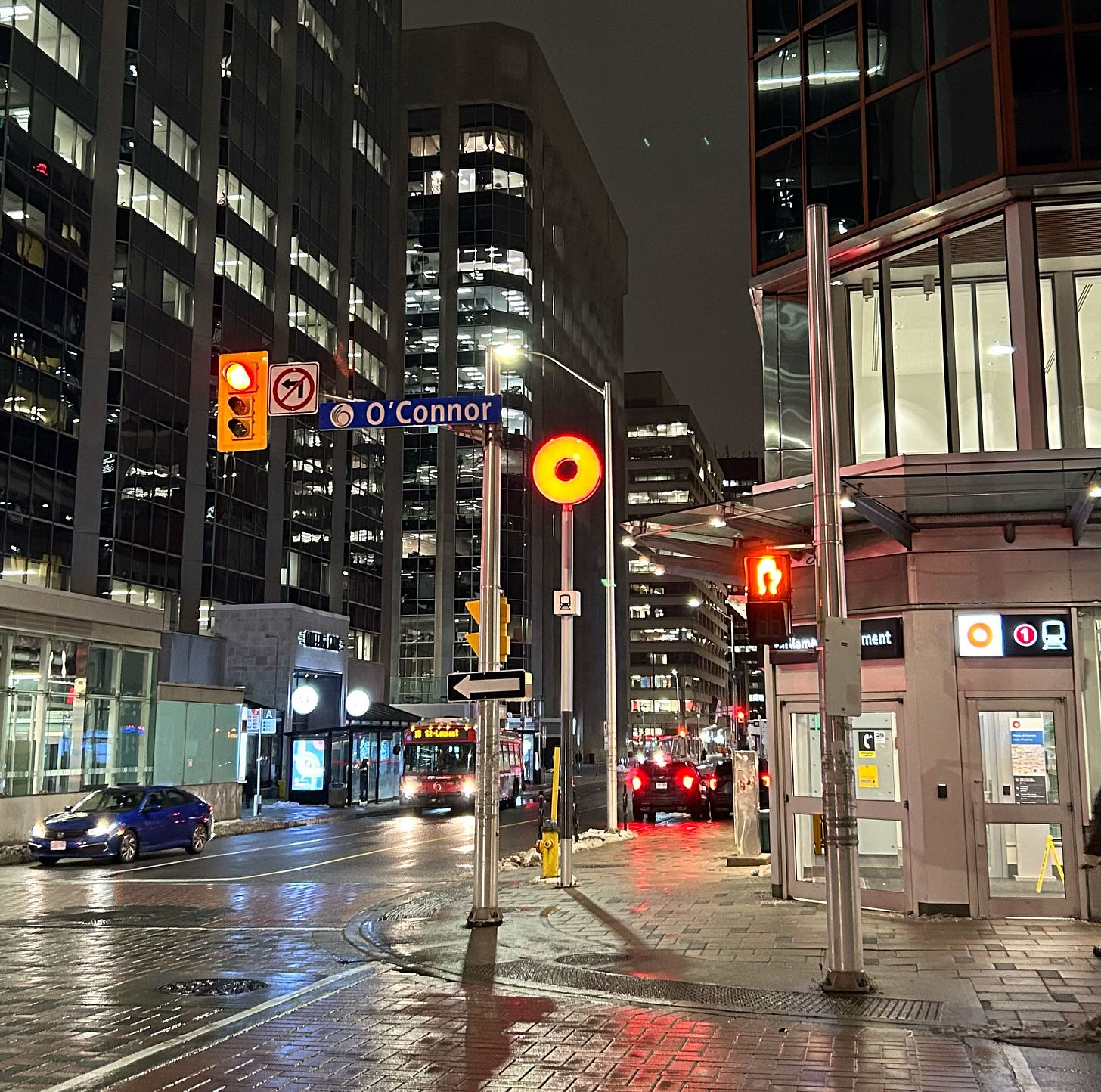 Parliament Station at night, intersection of Queen and O'Connor