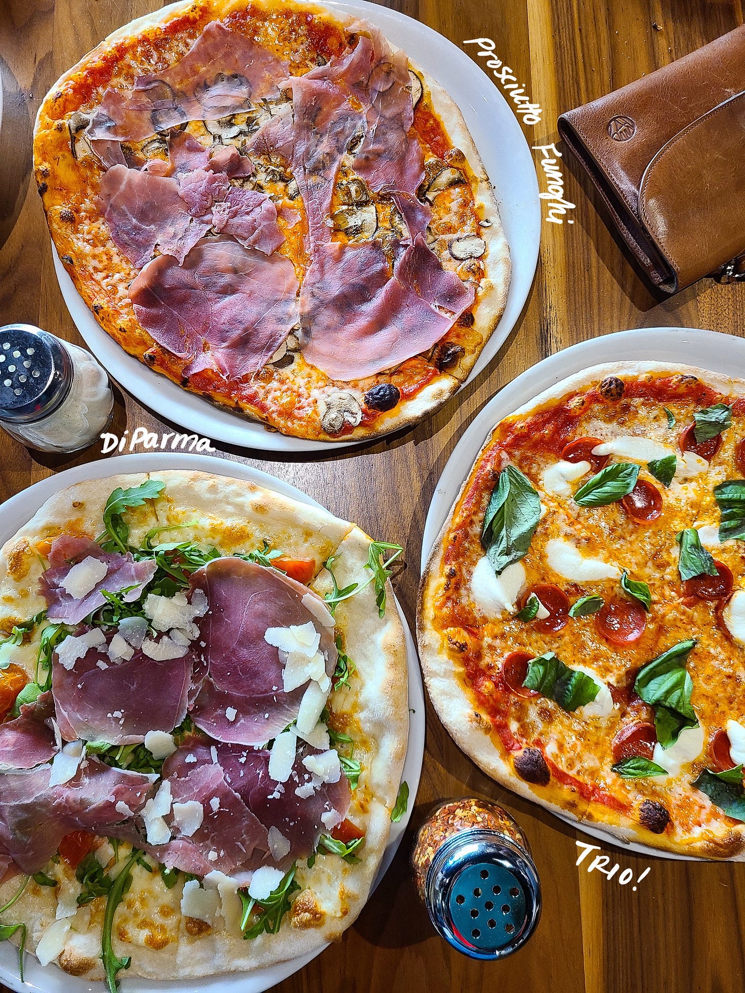 Pizzeria Omaggio lunch spread with 3 pizzas