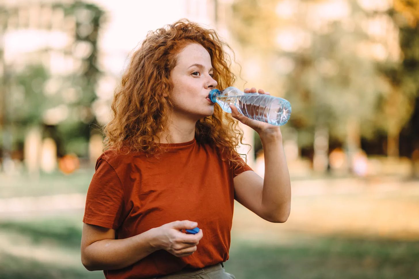 Woman drinking bottled water 