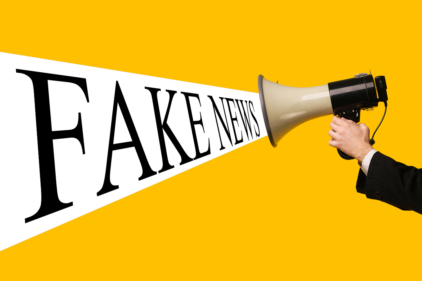Image of man in suit holding a megaphone. The words, "FAKE NEWS" are shown as if coming out of the megaphone.