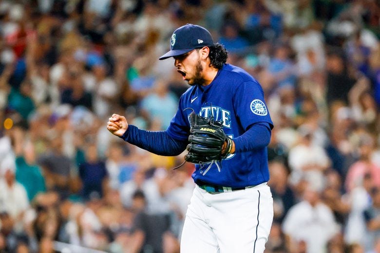 Seattle Mariners relief pitcher Andres Munoz pounds his glove after striking out New York Yankees&#8217; Andrew Benintendi to end the top of the ninth inning, Tuesday, Aug. 9, 2022, in Seattle. (Jennifer Buchanan / The Seattle Times)