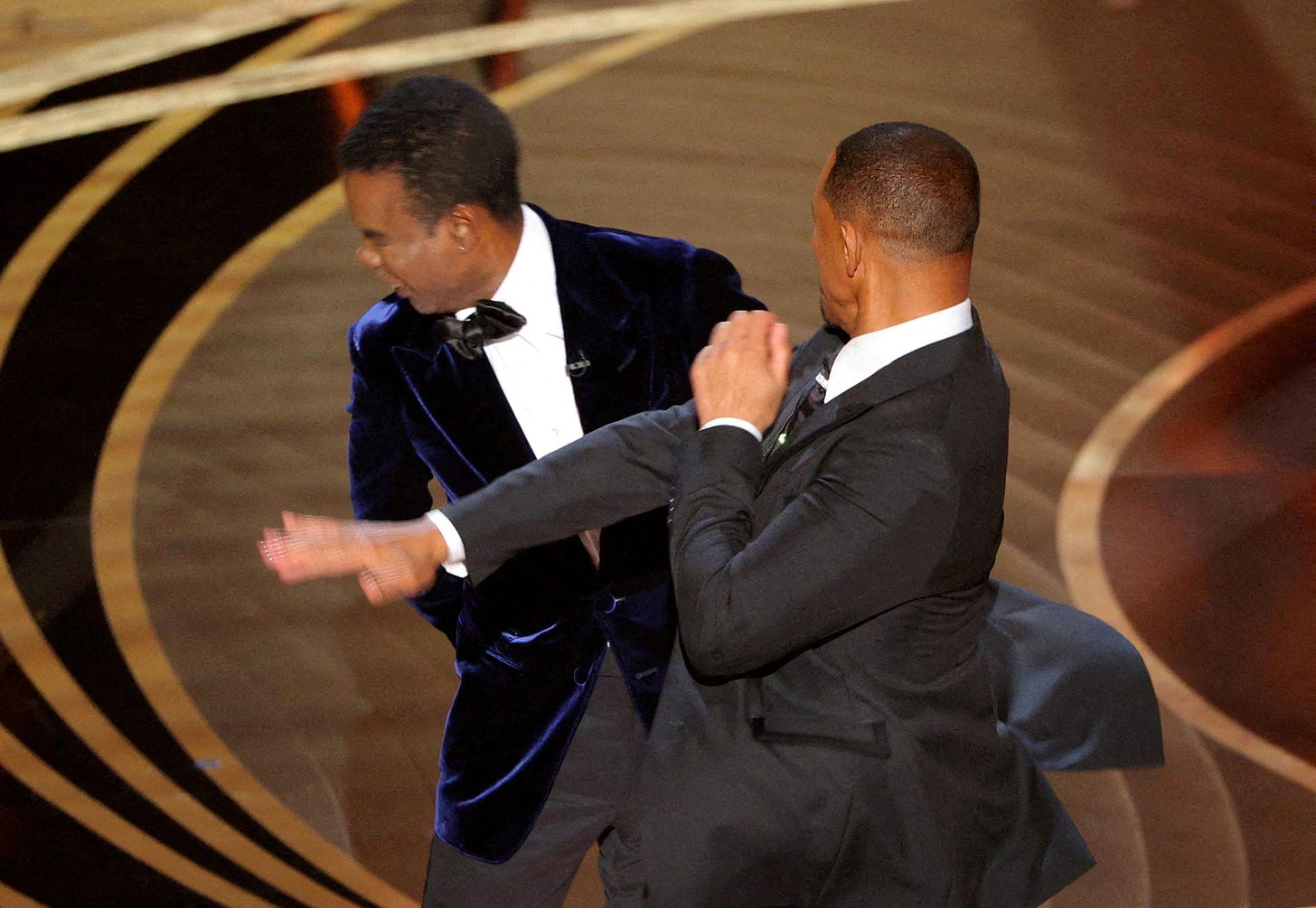 Chris Rock unleashes on Will Smith and wife Jada a year after Oscars slap |  Reuters