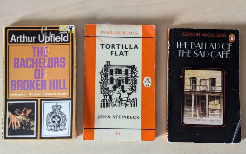 Old paperback copies of the three books quoted below.