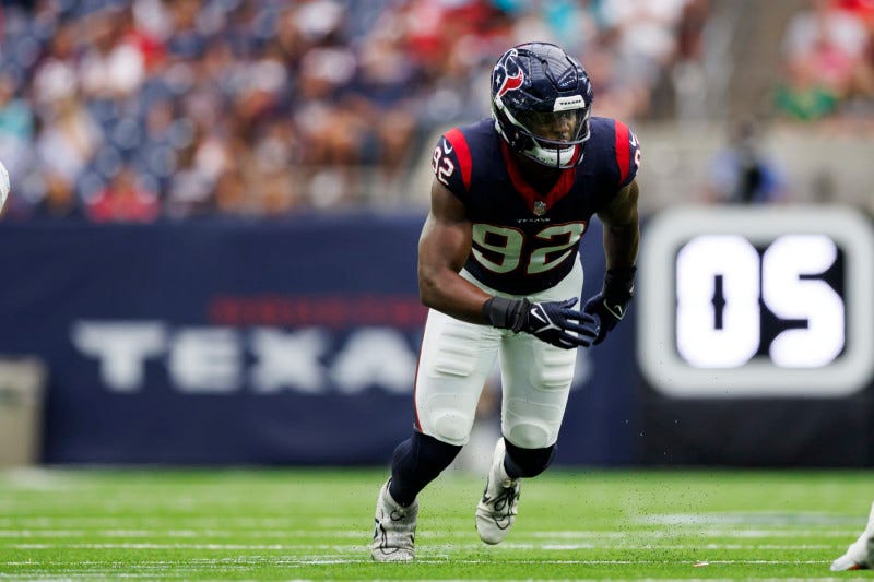 HOUSTON, TEXAS - AUGUST 19: Dylan Horton #92 of the Houston Texans runs around the edge during an NFL preseason football game against the Miami Dolphins at NRG Stadium on August 19, 2023 in Houston, Texas. (Photo by Ryan Kang/Getty Images)