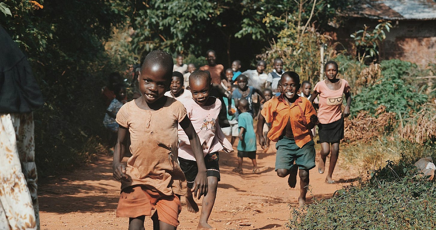 African kids run ning towards the camera African kids run ning towards the camera