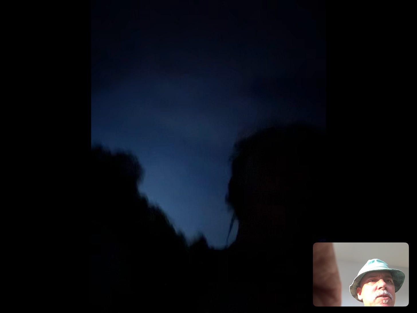 screen shot of video call with kids showing off the beautiful Wisconsin sky.