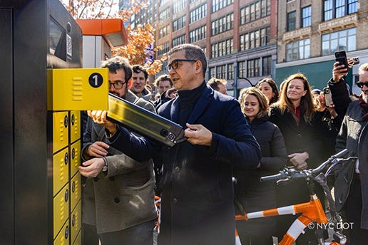 NYC DOT Commissioner Rodriguez charging a lithium-ion battery at a pilot charging location in Cooper Square, Manhattan. 