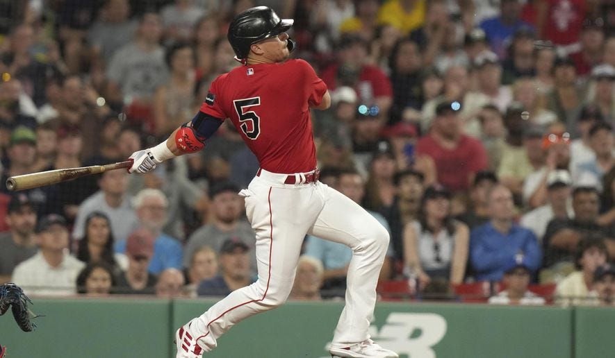 Boston Red Sox&#x27;s Enrique Hernandez follows though on his swing after hitting a two-run single in the seventh inning of a baseball game against the Texas Rangers, Thursday, July 6, 2023, in Boston. (AP Photo/Steven Senne)