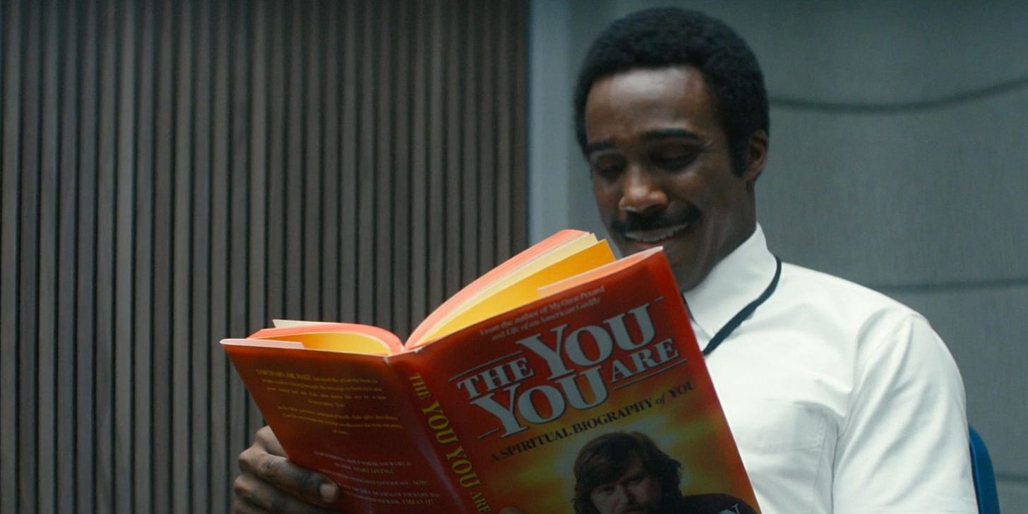 Still from Severance: Mr. Milchick reading The You You Are