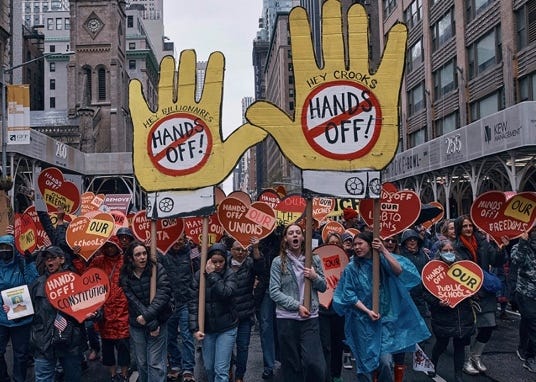 A group of people holding signs

AI-generated content may be incorrect.