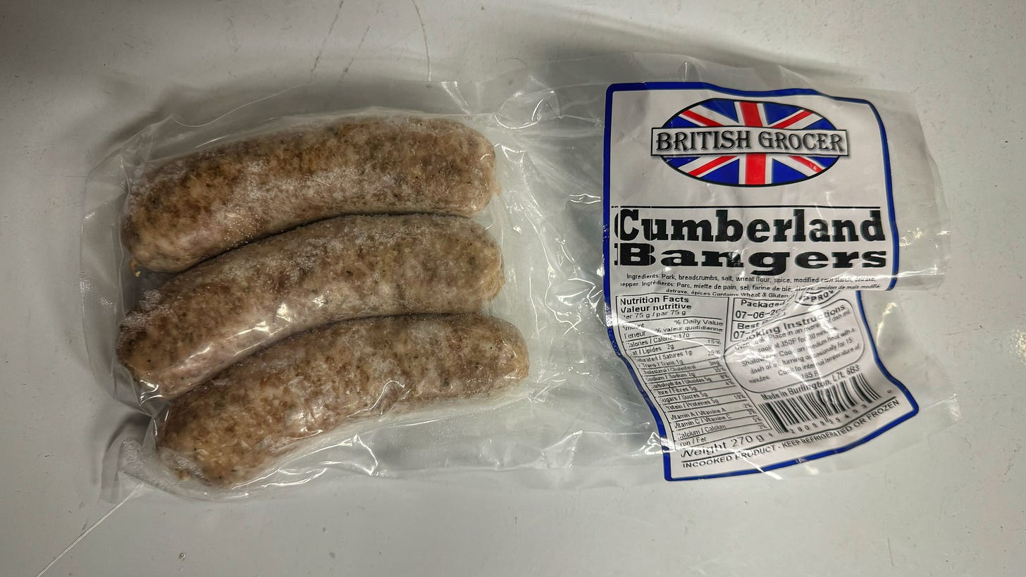 A frozen package of Cumberland Bangers with the logo of The British Grocer